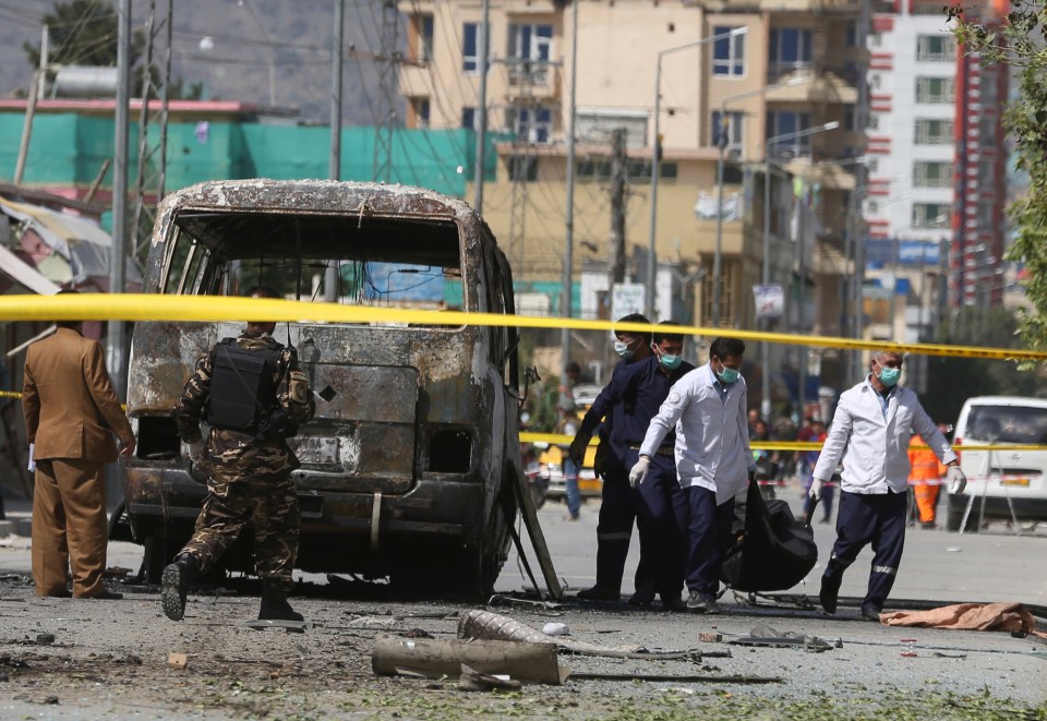  The aftermath of an explosion on a bus carrying government employees in Kabul in June