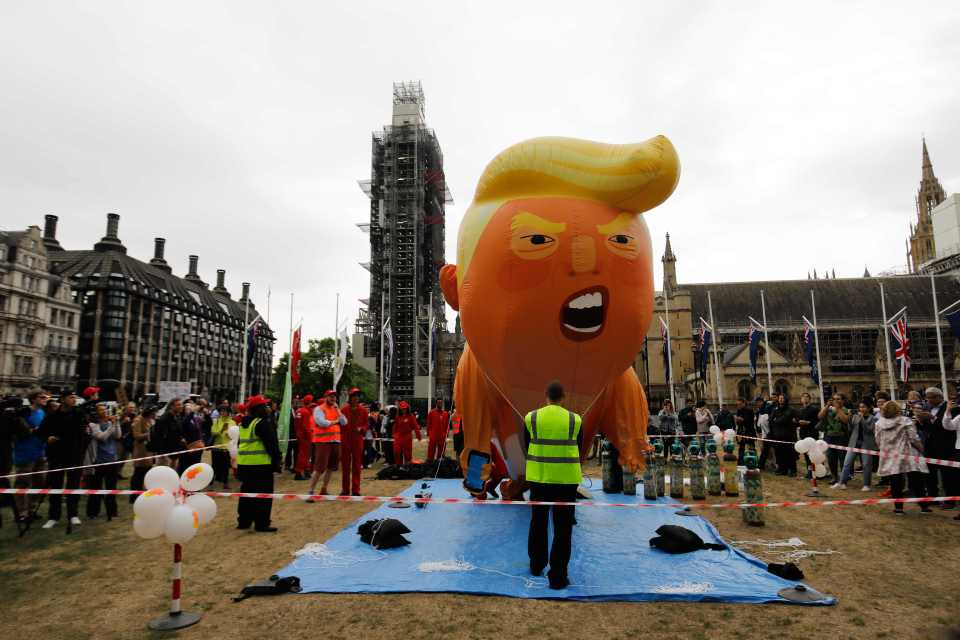  The Trump baby blimp being inflated in Parliament Square ahead of a mass demonstration in London this afternoon