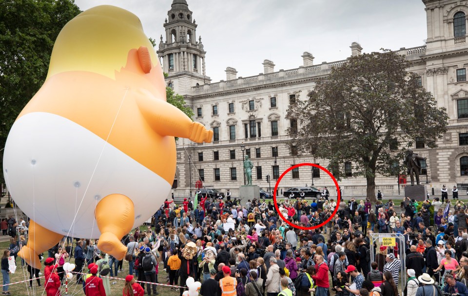  Donald Trump's motorcade, circled, driving past the baby blimp in Parliament Square today