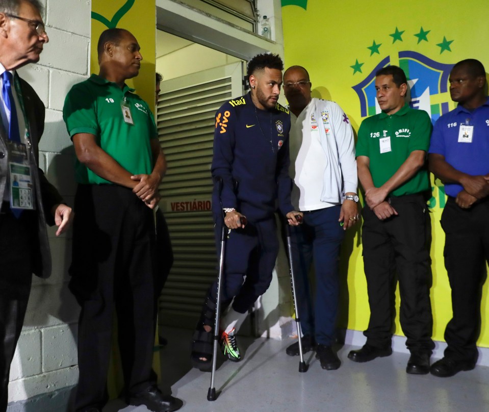  Neymar leaves the Mane Garrincha Stadium on crutches after picking up another injury