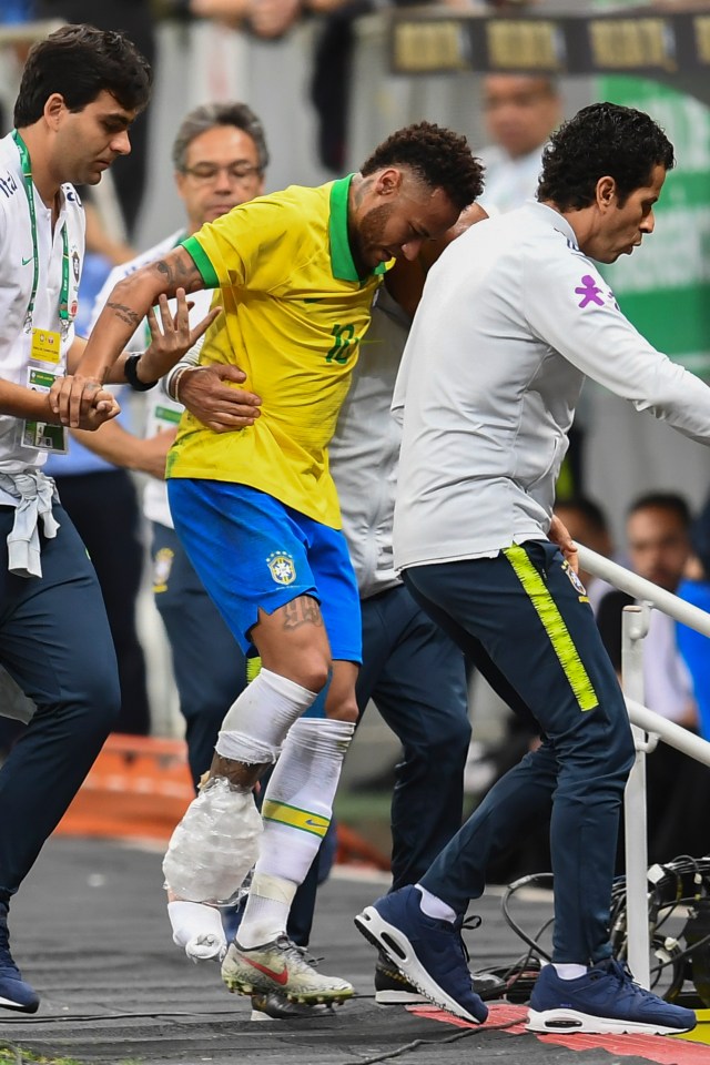  Neymar had to be helped off the pitch after injuring his ankle