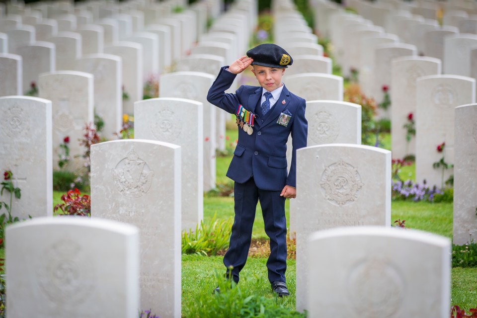  Little George salutes the graves of soldiers who fell in the conflict, which his great uncle also fought in