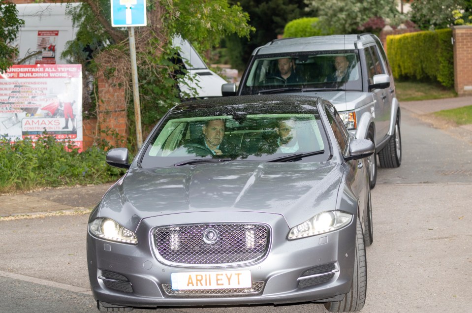  Mrs May's cars leaving her home today