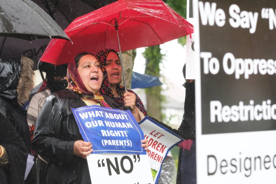  Demonstrators object to the school's use of particular relationship education materials, claiming the teaching is 'over-emphasising a gay ethos'