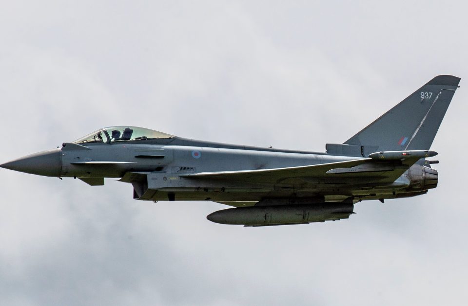 Typhoon fighter jets were called to action today following reports of a woman allegedly trying to open the cockpit door