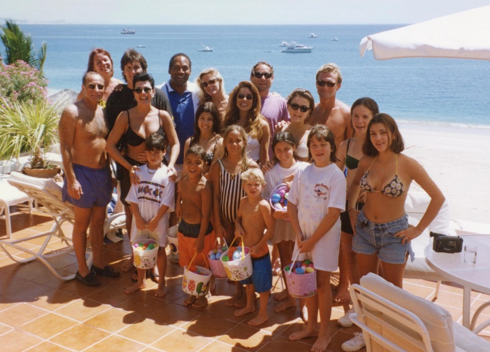 OJ Simpson pictured smiling with the Kardashian family at the beach