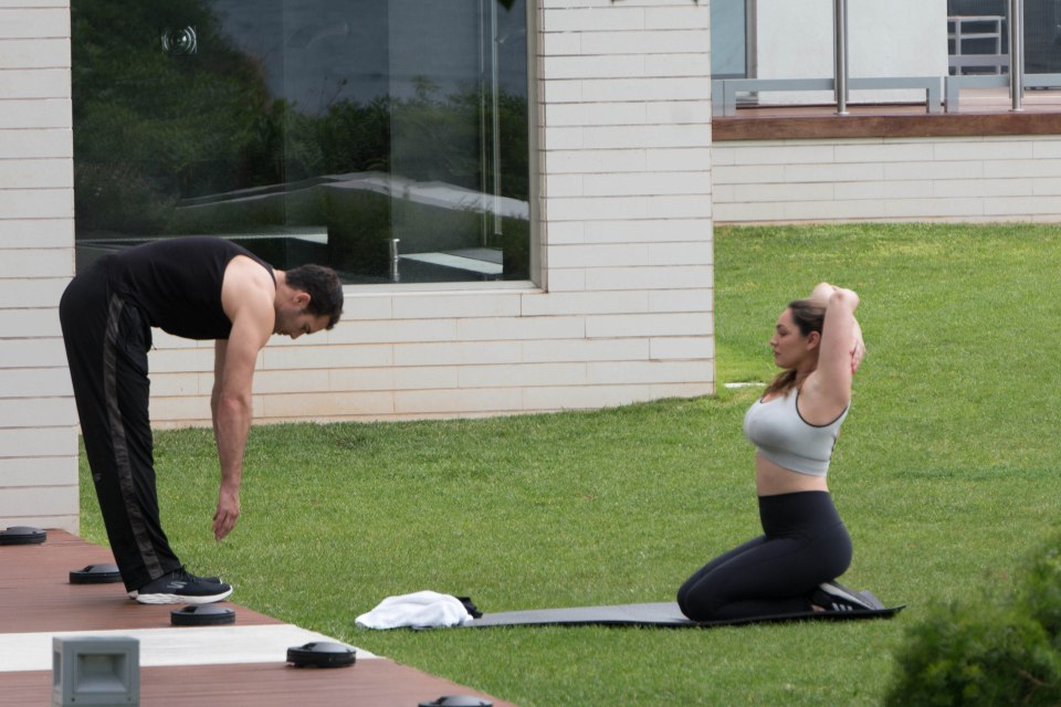  The couple did their stretches in solemn silence