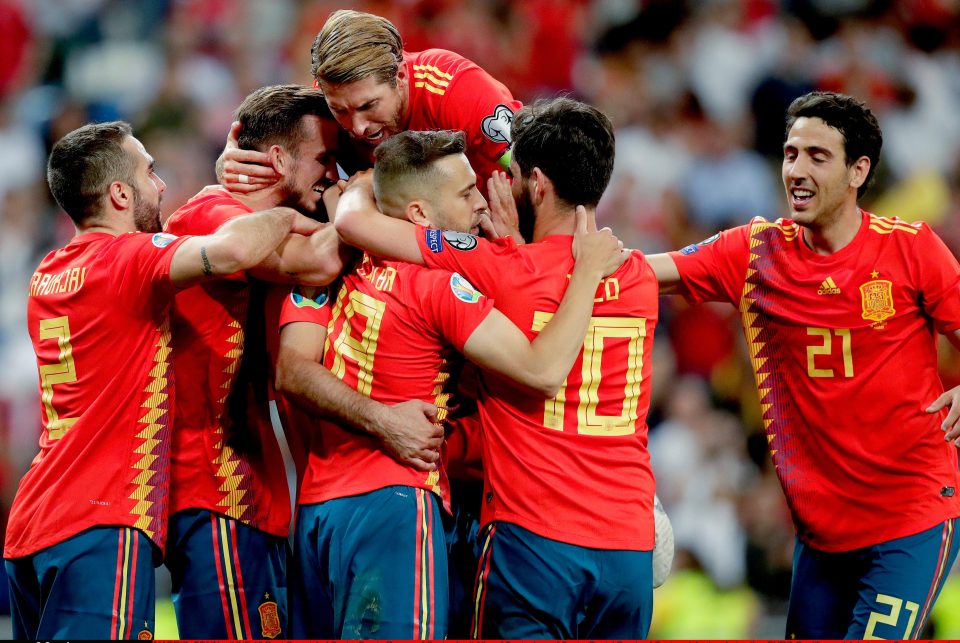 Skipper Sergio Ramos is mobbed after grabbing a 64th minute breakthrough from the spot