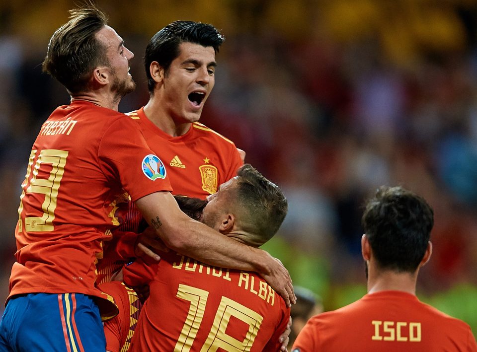 Fabian Ruiz and Co help Alvaro Morata celebrate after he made it 2-0 to Spain late on