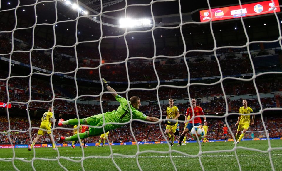 Sweden keeper Robin Olsen is powerful to stop this delightful clincher from Spain debutant Mikel Oyarzabal 