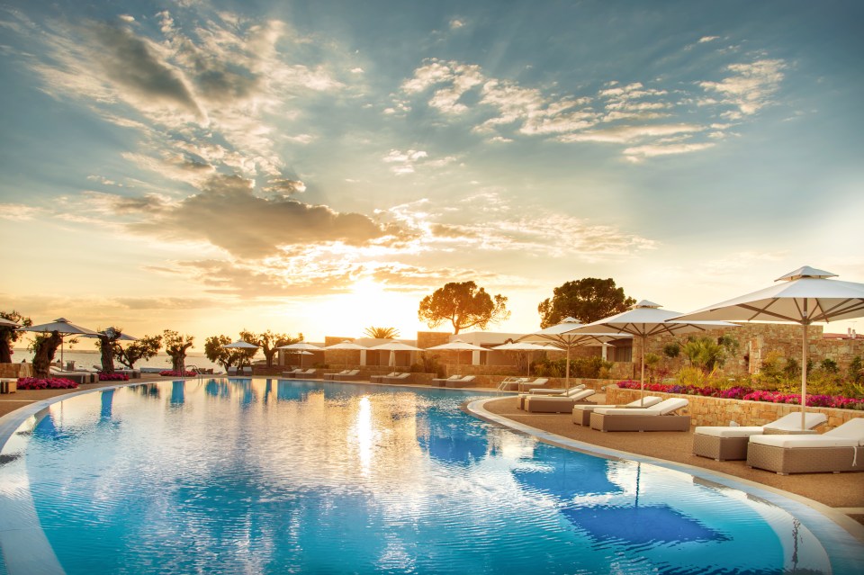  Kick back and relax while watching the sunset glisten over the pool