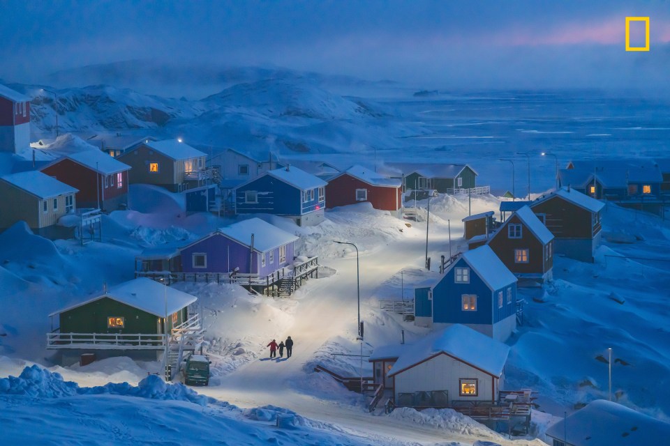  Chu Weimin's 'Greenlandic Winter' of Upernavikis, a fishing village on a tiny island in west Greenland, won the grand prize. He said: 'Historically, Greenlandic buildings were painted different colors toindicate different functions, from red storefronts to blue fishermen’s homes—a useful distinction when the landscape is blanketed in snow'