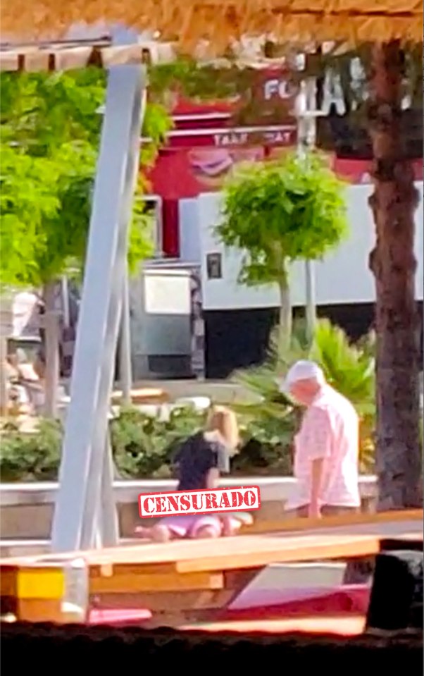 The mystery British couple continued romping as an elderly local walked past