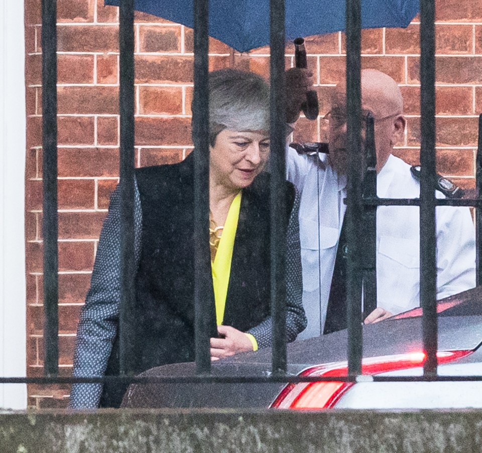  Theresa May pictured leaving Downing Street on Wednesday and heading back to Parliament