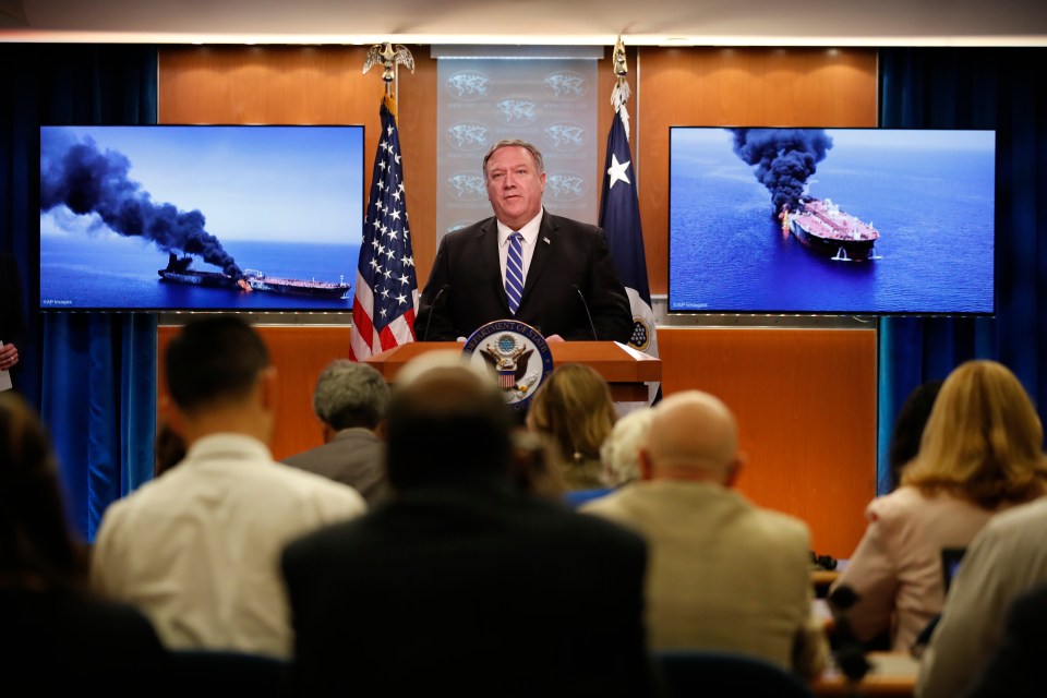 Secretary of State Mike Pompeo standing in front of pictures of the tankers attacked in the Gulf