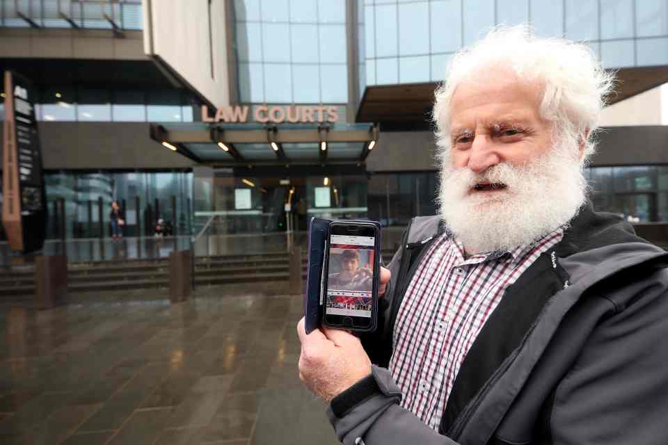  John Milne, father of Sayyad Milne who was killed in Christchurch mosque attacks, shows a photo of his son