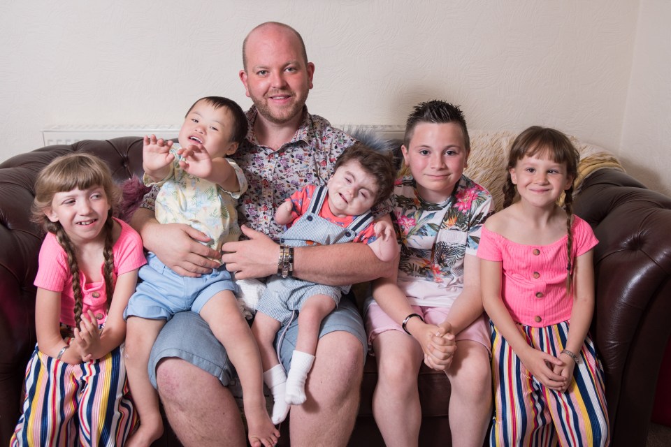  'Super dad' Ben Carpenter with his five kids - all of whom have disabilities