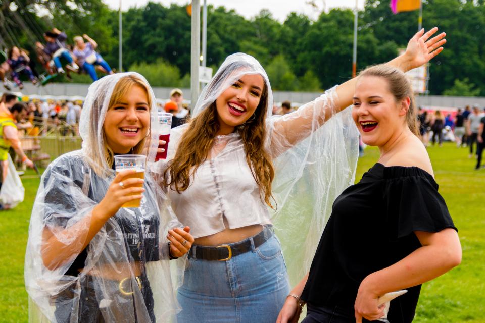  Music fans refuse to let their spirits be dampened by the rain at a Southampton music festival