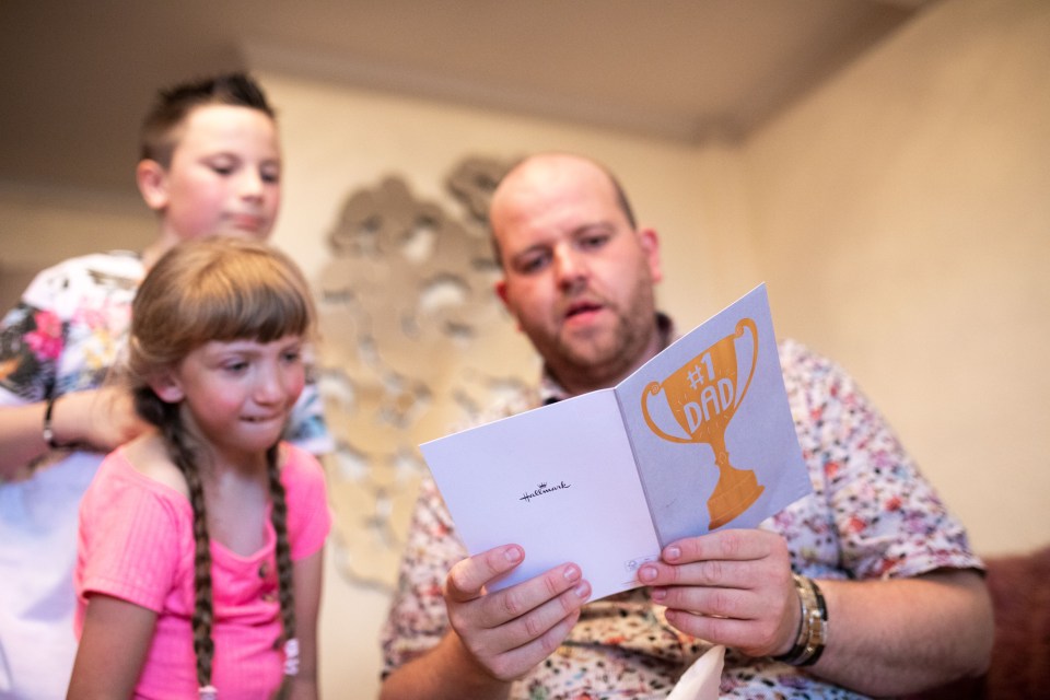  Ben getting a card from his kids at their home in West Yorkshire