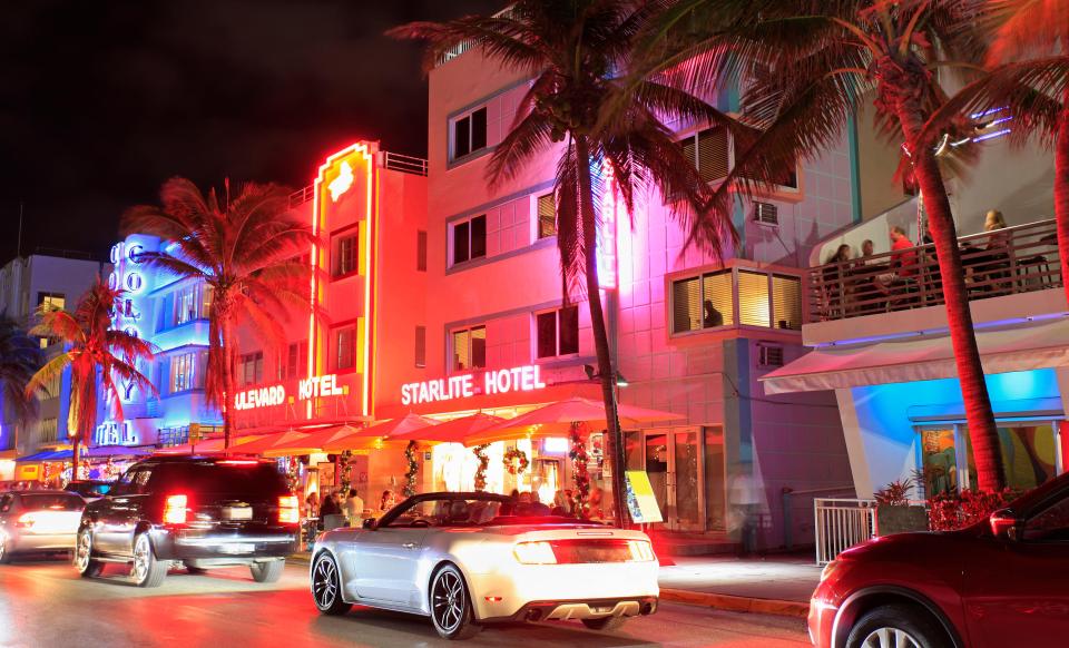  Ocean Drive Art Deco buildings illuminated at dusk in Miami Beach