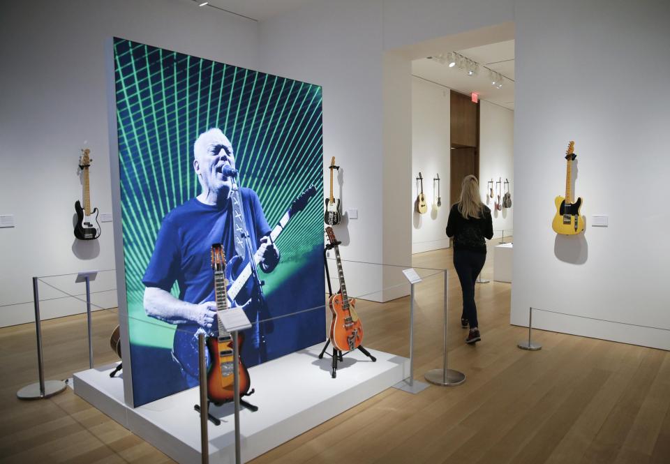  The auction was packed out as fans splashed out £17million on guitars from Gilmour's star career