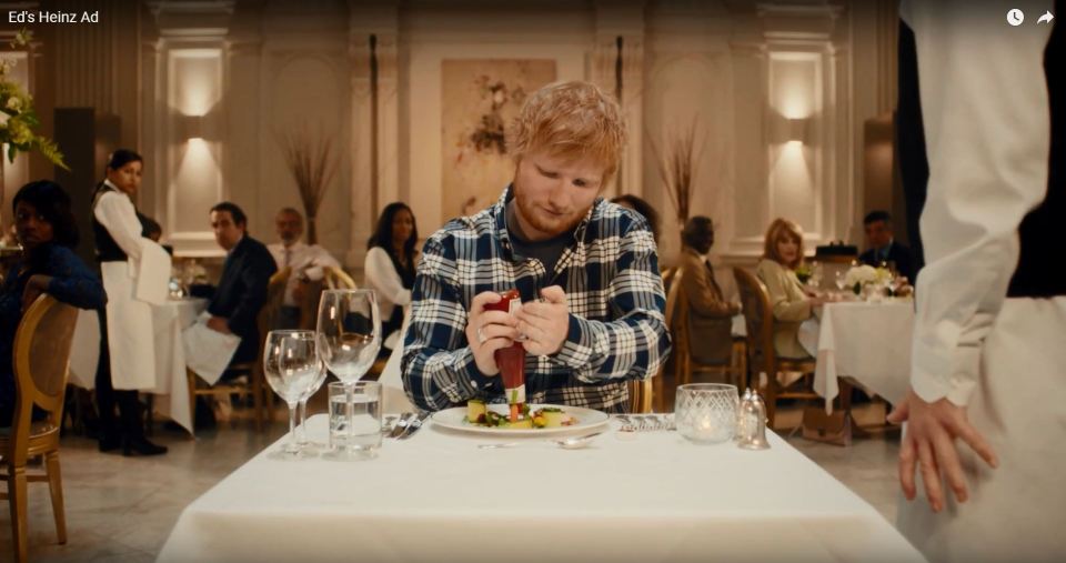 The ginger one pulls a bottle of ketchup out of his bag and dollop it on his posh meal