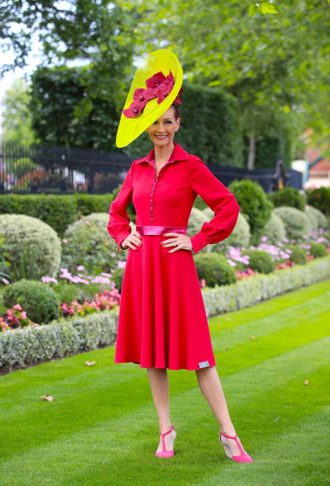 Chelsey Baker, CEO and Founder of National Mentoring Day, wears a fuchsia dress and a bright yellow fascinator