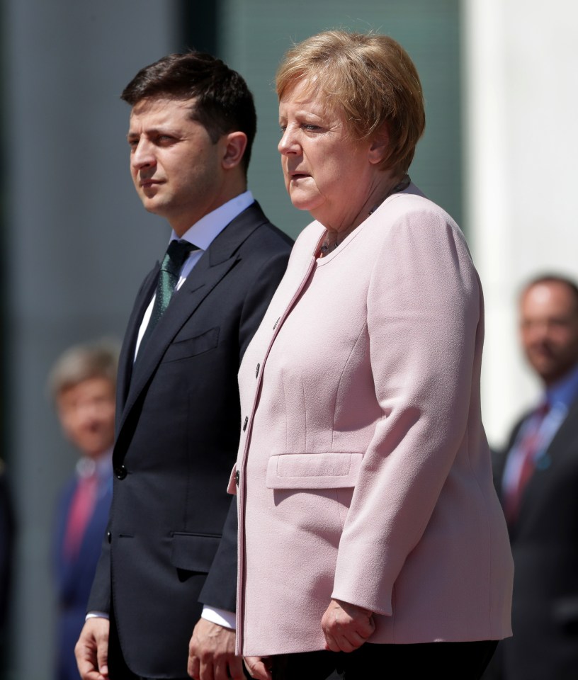  German Chancellor Angela Merkel trembles beside Ukraine's President Volodymyr Zelenskiy