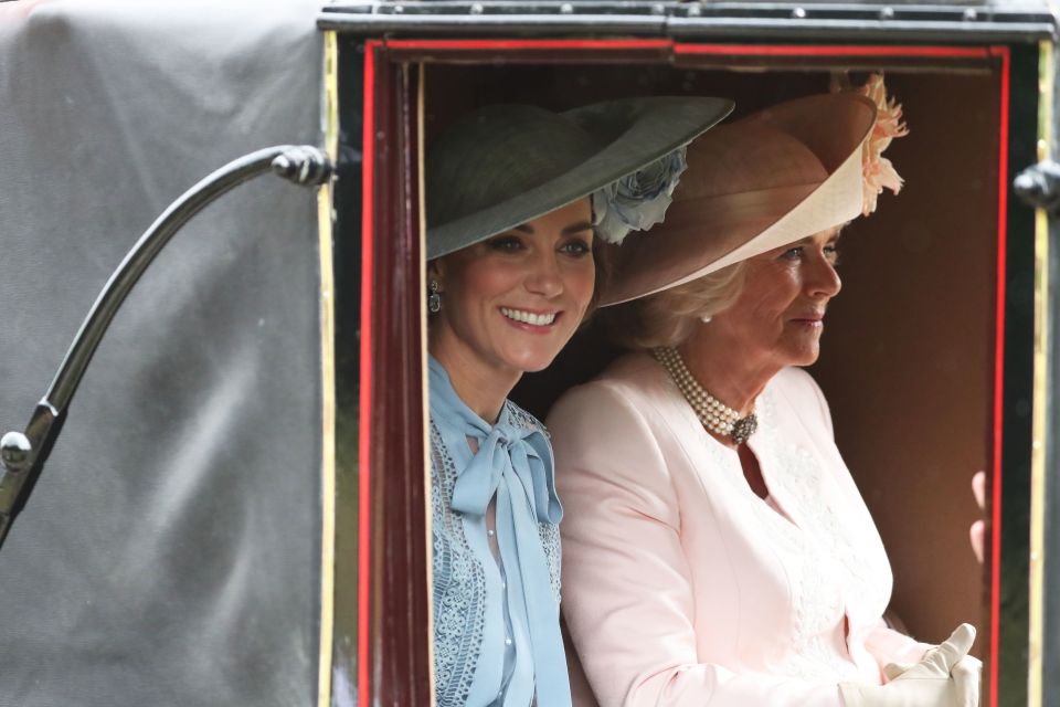 Kate smiles as she sits next Camilla for the first day of the Royal Ascot