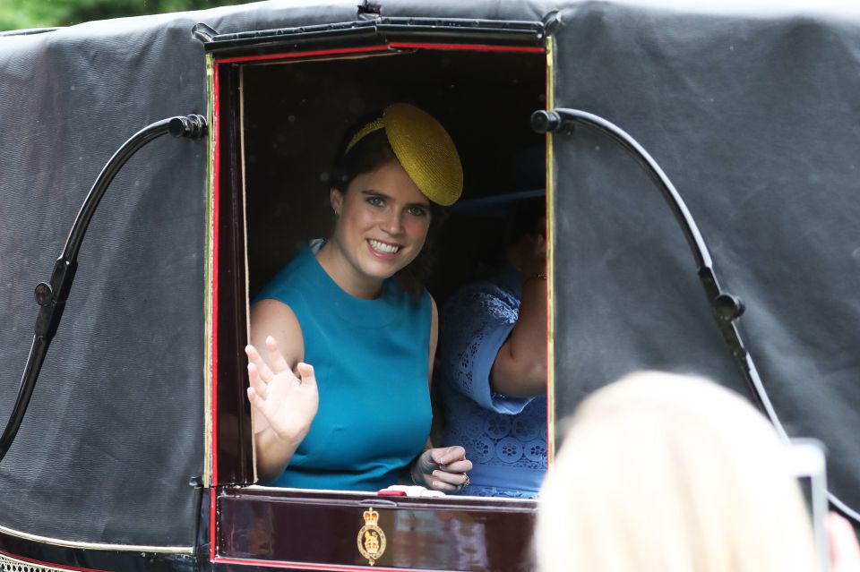 Princess Eugenie in a mustard yellow fascinator waves to crowds