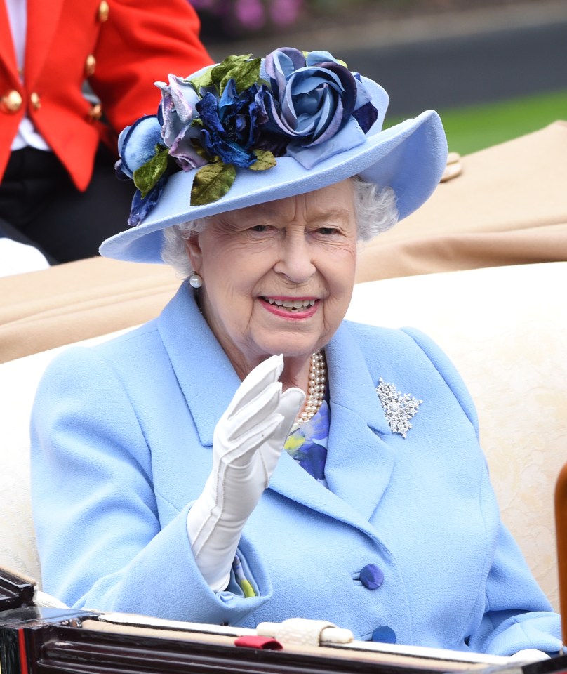 The 93-year-old waves to royal well-wishers