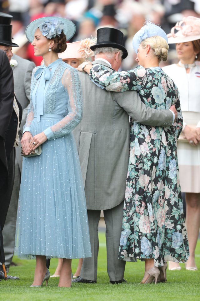  Charles and Zara were pictured throwing their arms around each other at the horse racing event