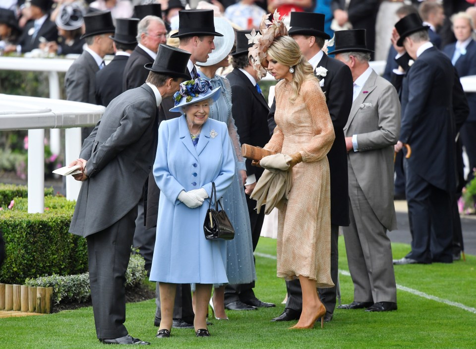 Queen Maxima and her Majesty have a chat after getting out of their carriage at the Royal Ascot