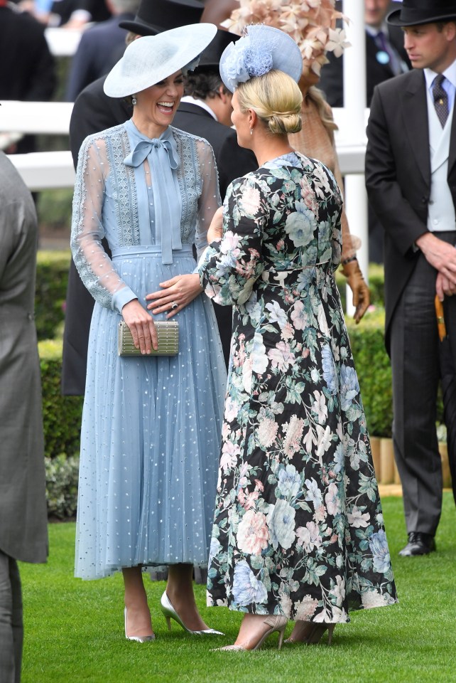 Kate and Zara share a joke as they giggle at the Royal Ascot