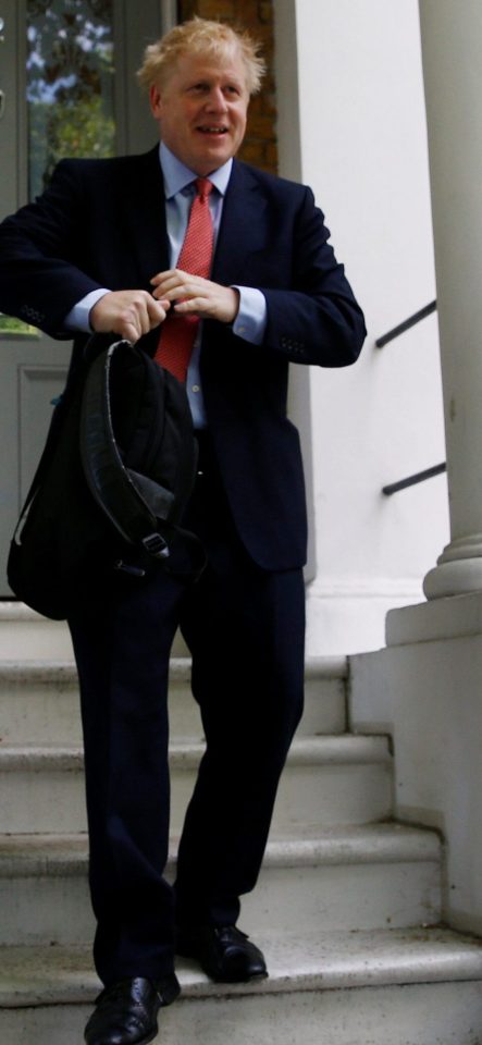 Boris Johnson leaves the London flat he shares with his partner