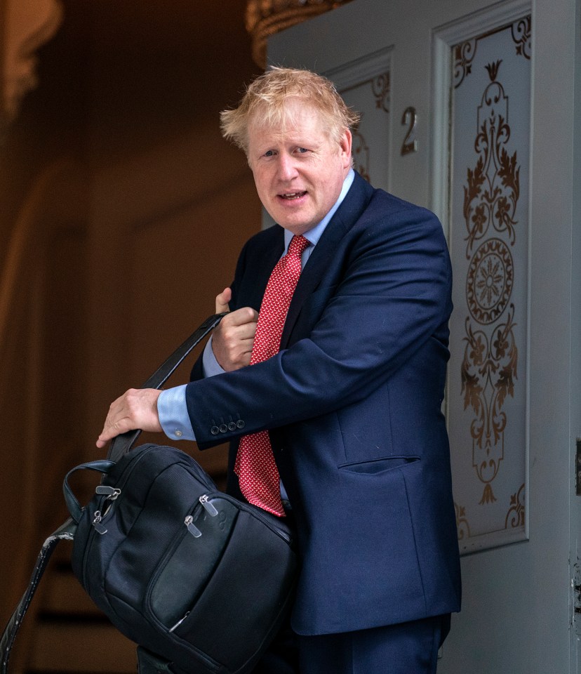  Boris Johnson leaving his flat after cops were called hours earlier