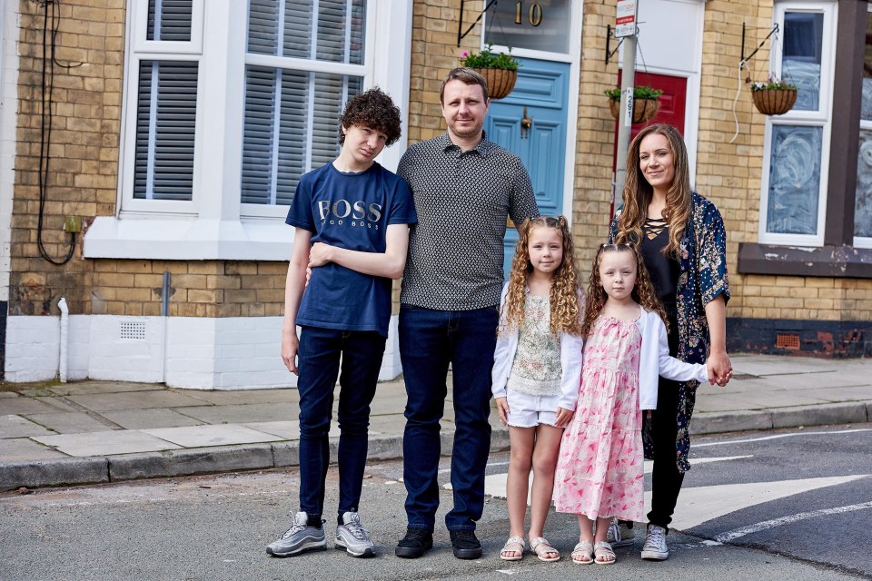  Mel and Rob with their three children outside their £1 home in Liverpool