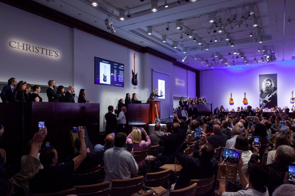  The event started an hour late because guitar-hungry fans were queuing around the block in the Rockefeller Center