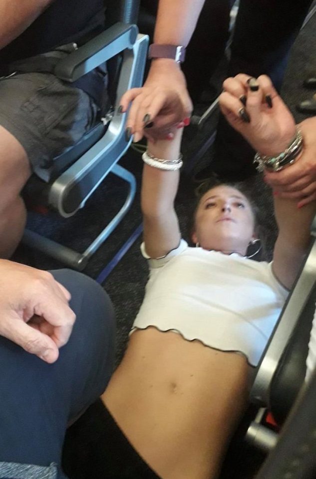 She was restrained after allegedly threatening to kill passengers