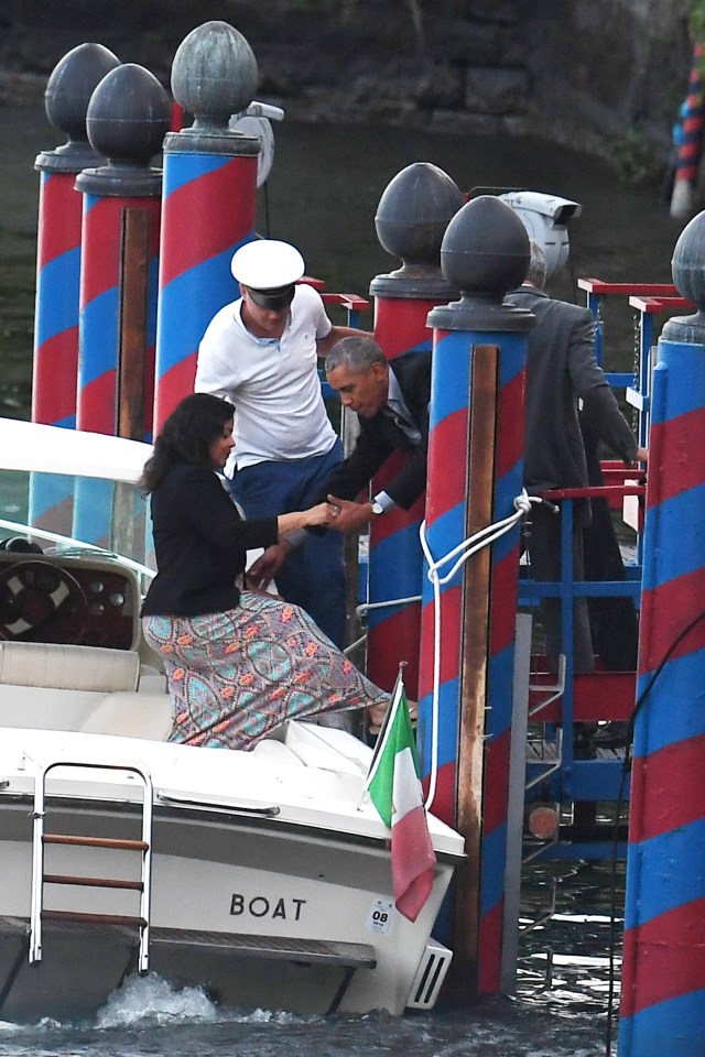  President Obama was seen helping a female friend off the boat after they arrived at the residence