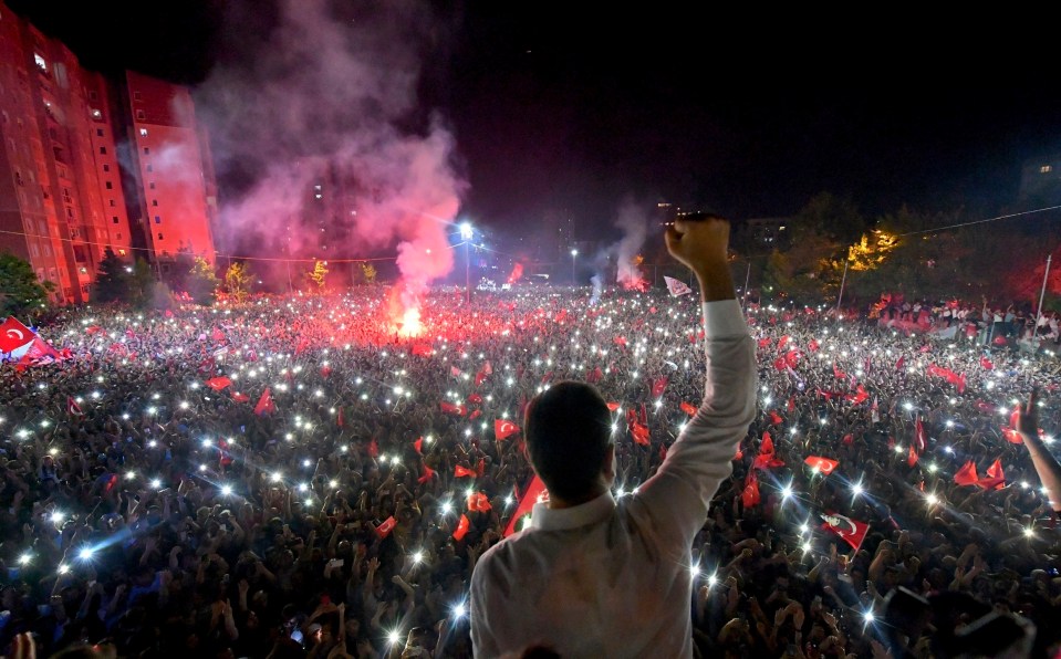  Imamoglu raises his fist in victory as crowds cheer in Istanbul on Sunday night