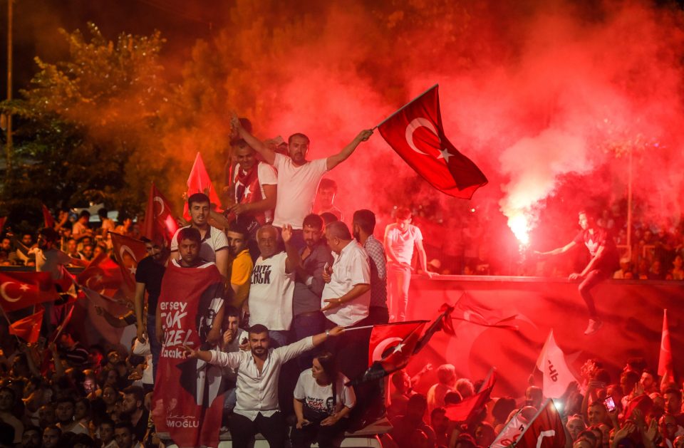  Crowds lit flares and waved Turkish flags during the victory rally