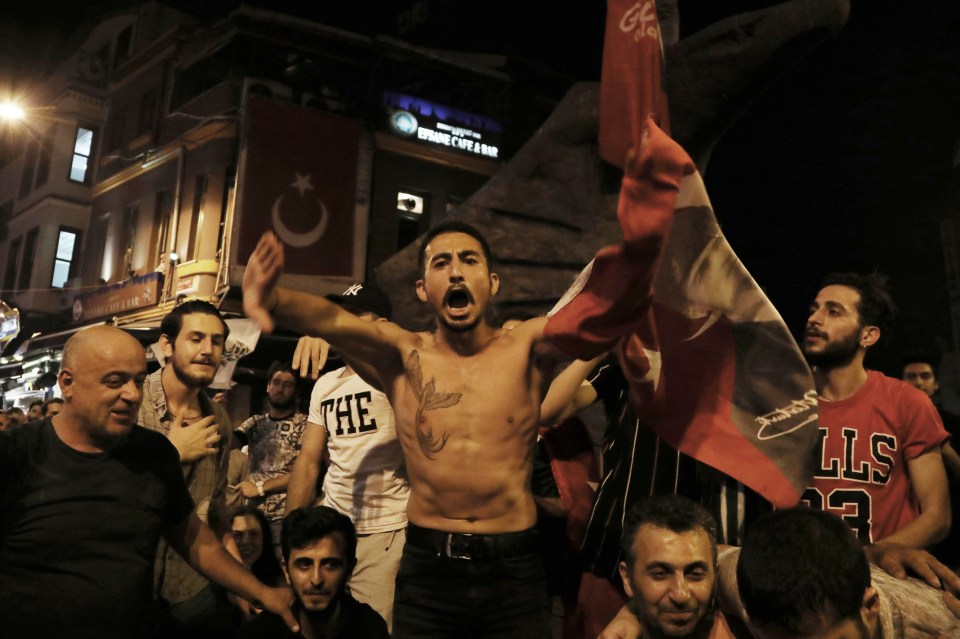  A supporter cheers for the camera amid jubilant celebrations in Istanbul