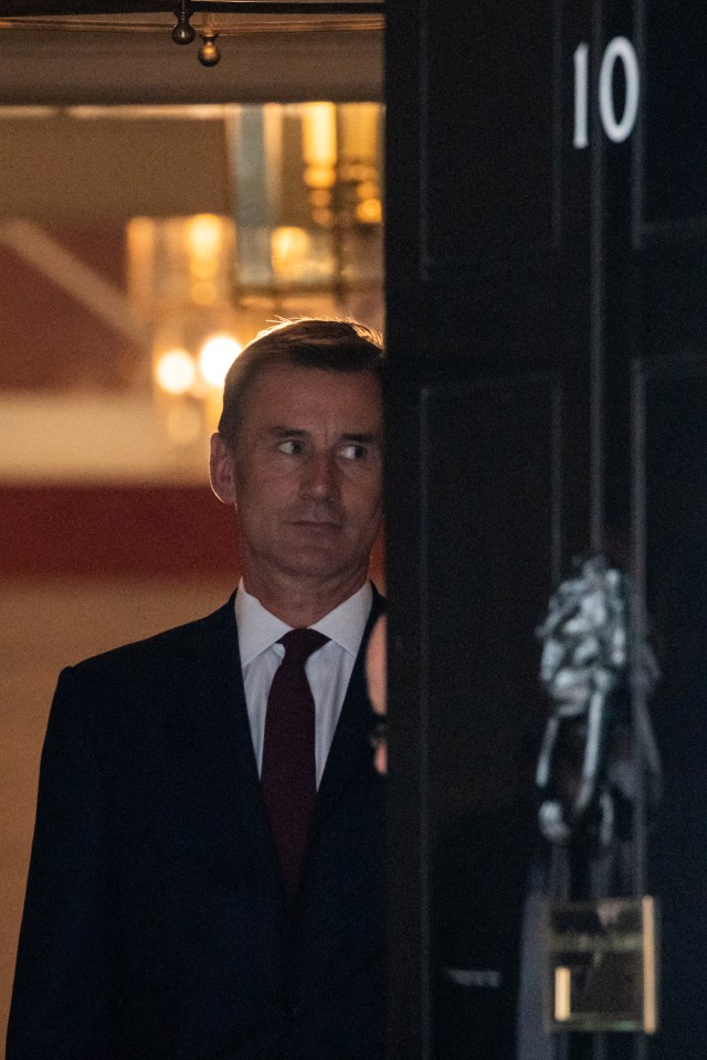 Rival Jeremy Hunt staring wistfully at the No10 door as he leaves this morning