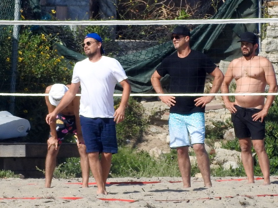  The actor, 44, took the whack while playing the popular beach sport with the singer and pals