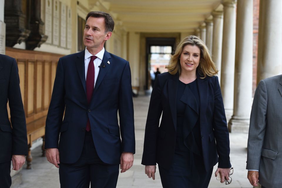  Boris challenged Mr Hunt, seen here with Defence Secretary, Penny Mordaunt, to match his October 31 Brexit guarantee, 'no ifs, no buts'