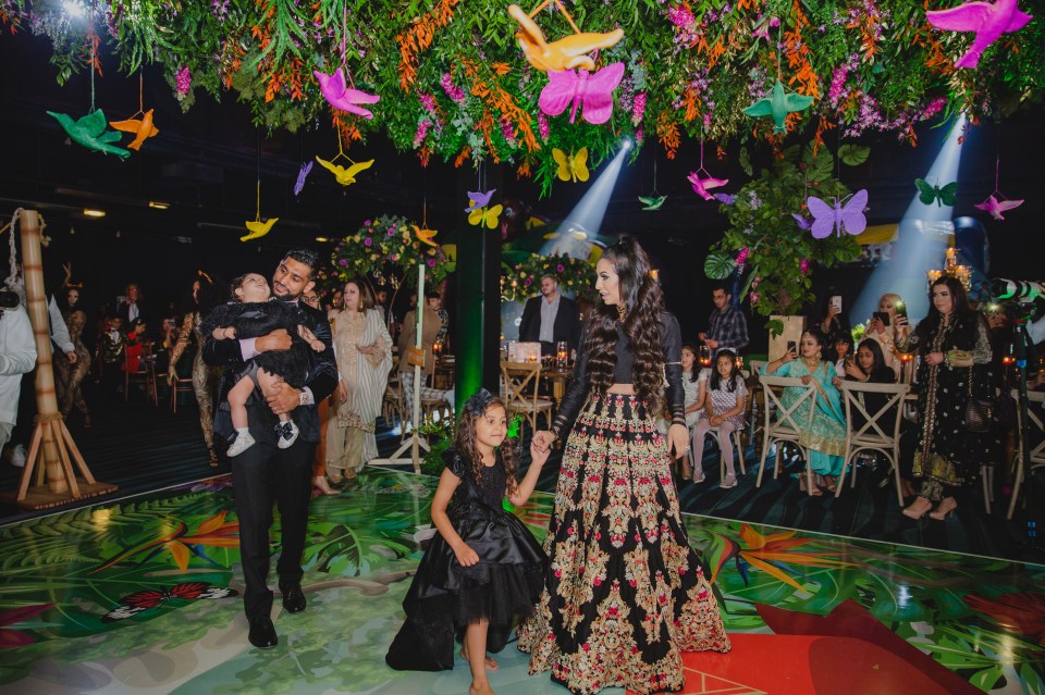  The family of four took to the floor to dance together while guests watched on