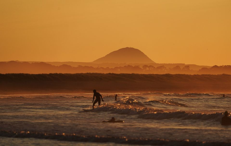 This surfer glides through the waves in Scotland at sunset on June 26