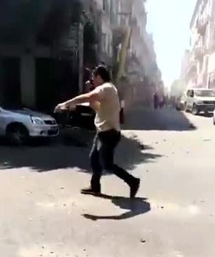  A member of the security forces with a radio near the scene of the blast