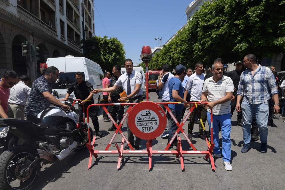  Tunisian security forces cordon off the site of an attack